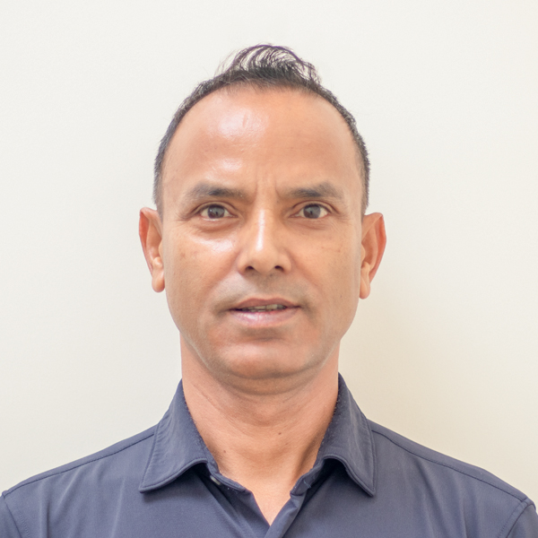 head shot of a smiling Nepalese man called Sushil Baral
